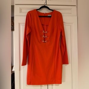 Plunge cut orange dress with gold detail